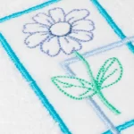 TOALLA DE ROSTRO BORDADA FLOR MARCO CELESTE - Imagen 2